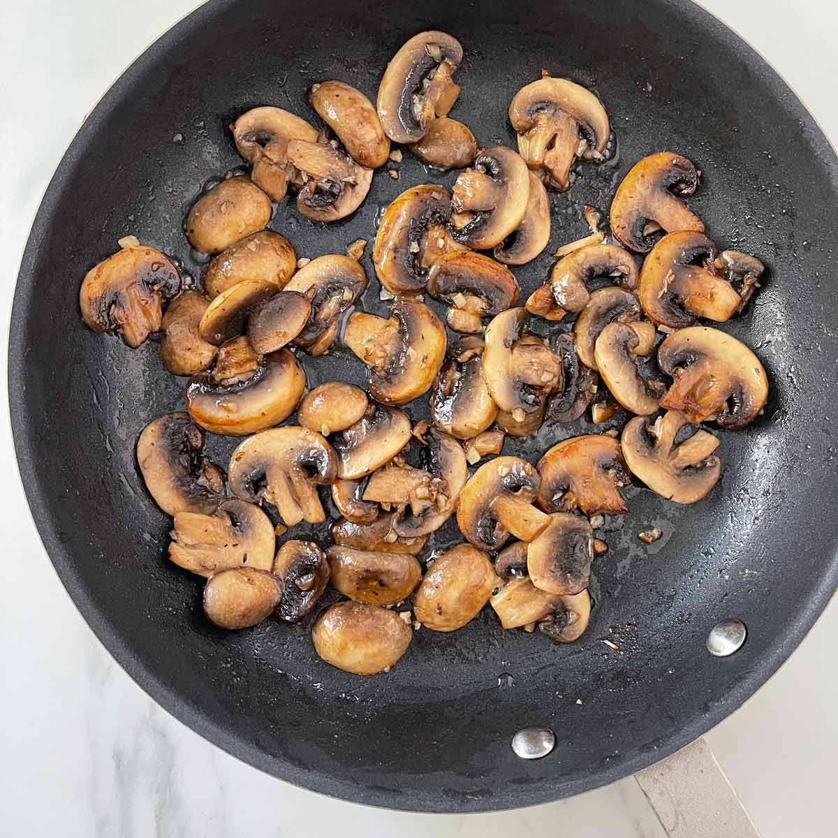 Golden brown garlic mushrooms.