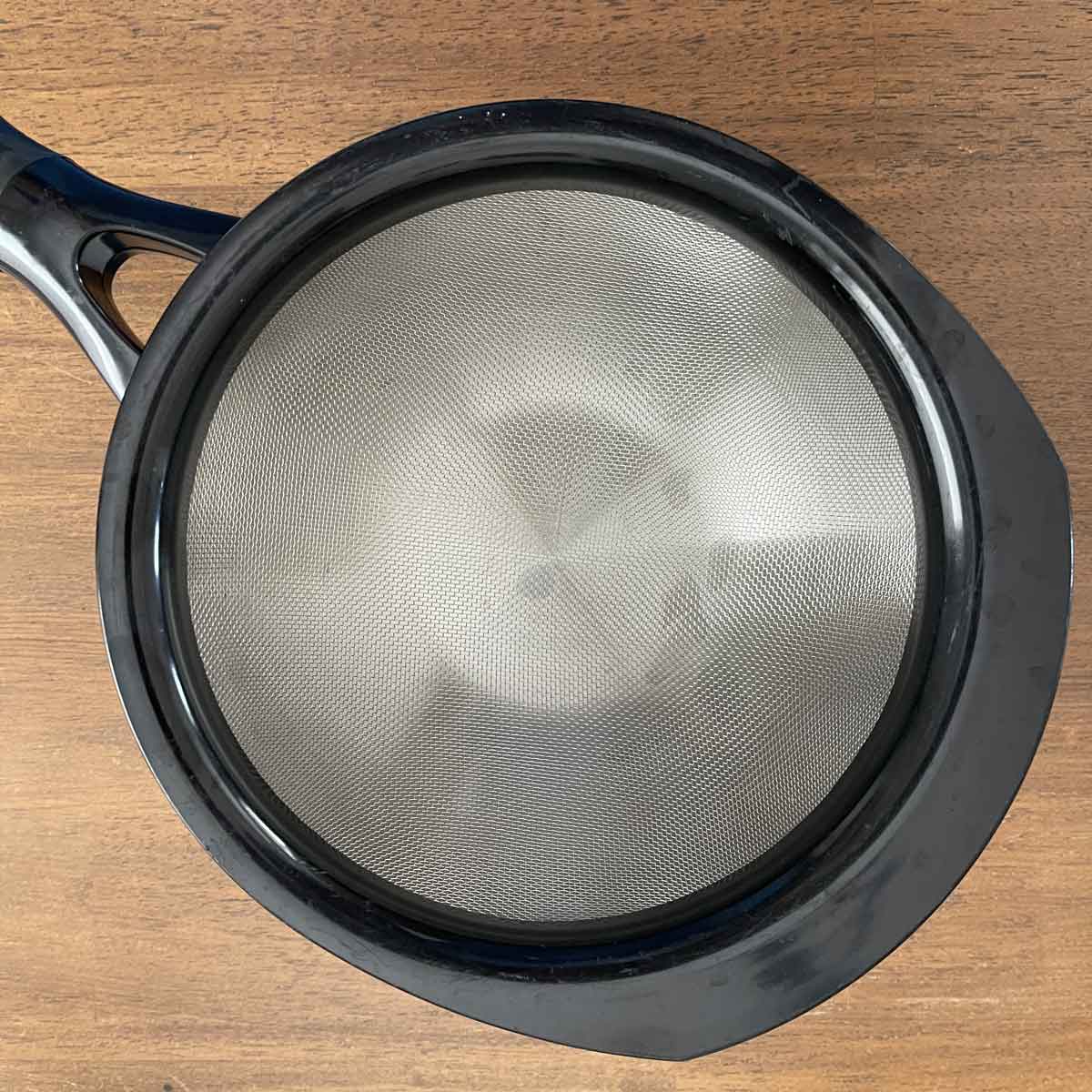 Sieve over bowl.