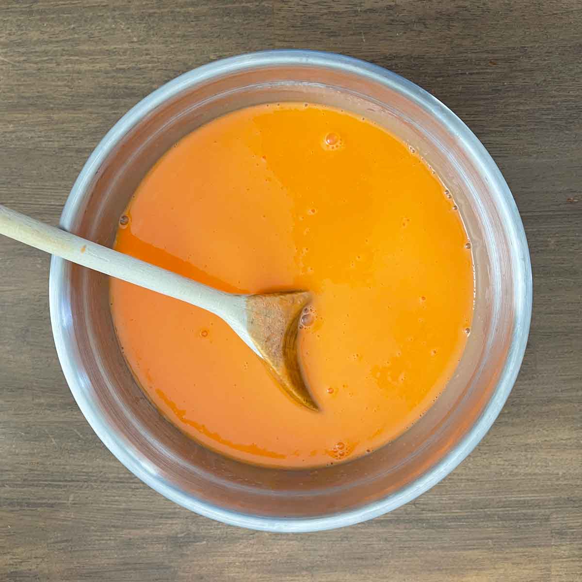 Stirring mixture for cany corn ice cream.