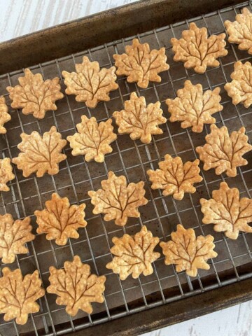 Baked crust leaves on cooling rack ducted with cinnamon.