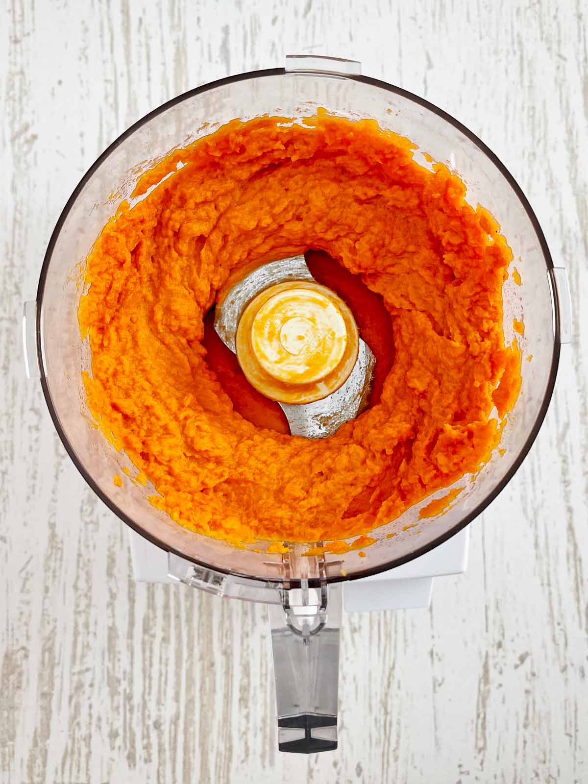 Sweet potato puree in a food processor bowl.