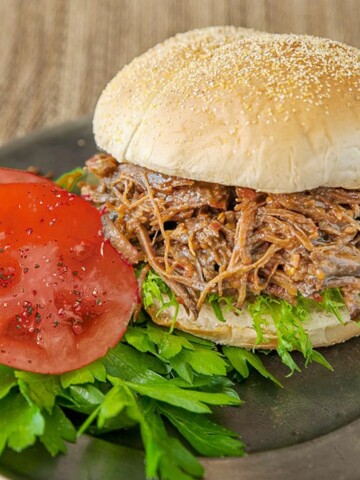 Beef barbeque sandwich with cornmeal topped bun.