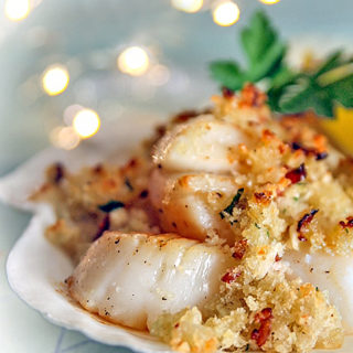 Scallops with gold brown topping.