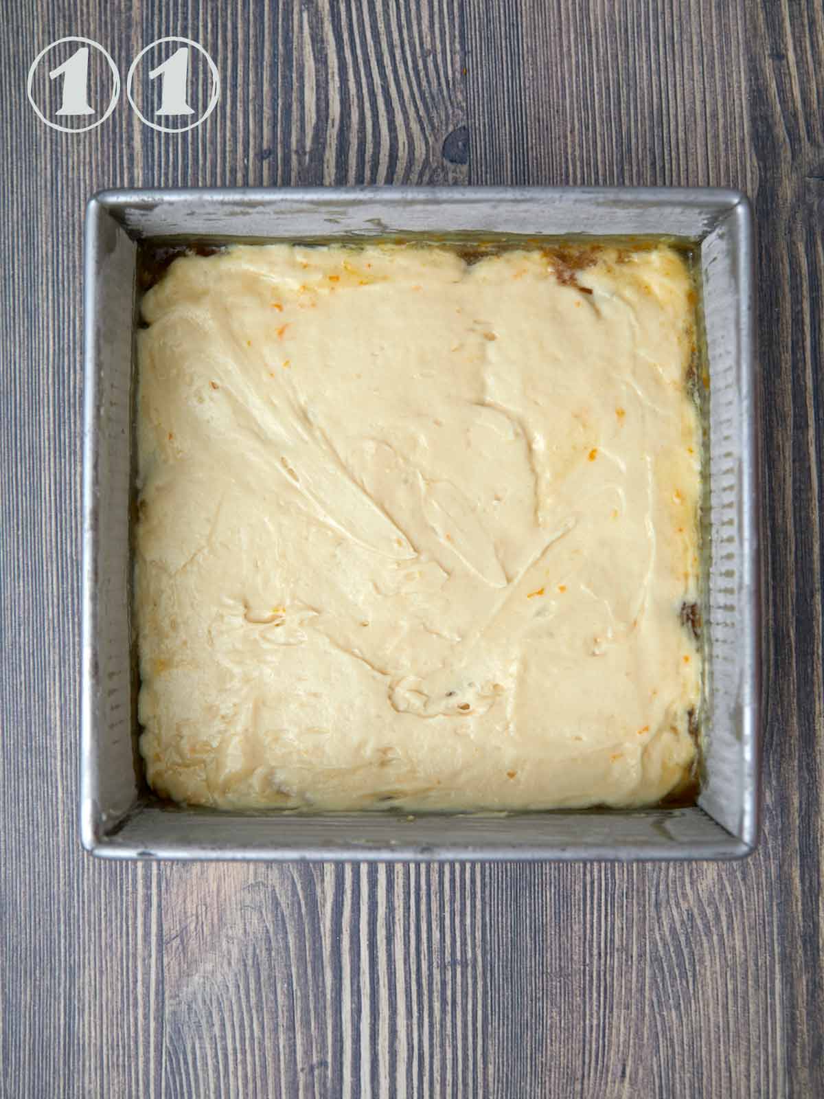 Top layer of cake batter spread out evenly in the pan.