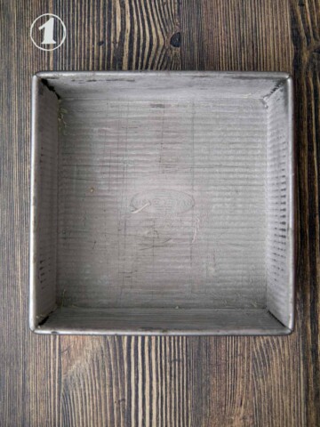 Eight inch square baking pan that has been buttered and floured.