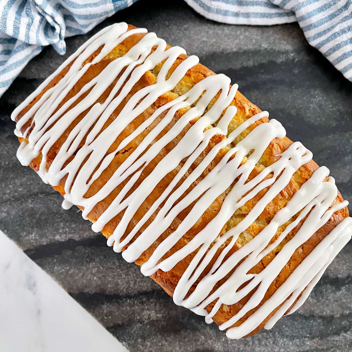 Meyer Lemon Pound Cake Recipe baked and glaze drizzled on top.