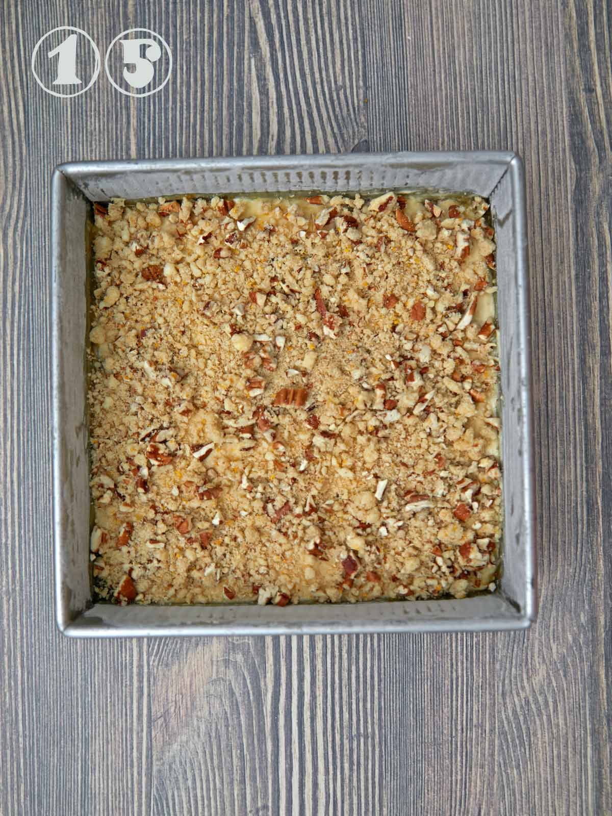 Topping mix evenly distributed over the top layer of the cake batter.