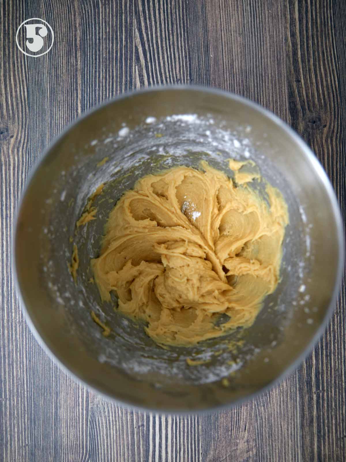 Mixing bowl with the cake batter.
with one third of the dry ingredients.