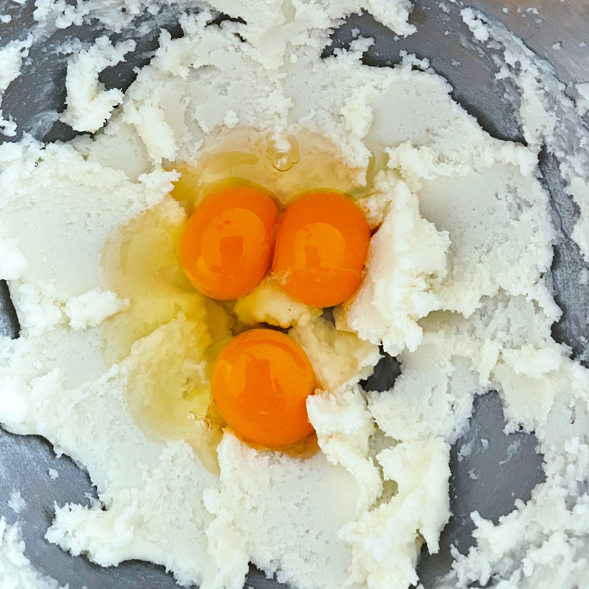 Creamed sugar and butter with 2 eggs and an egg yolk.