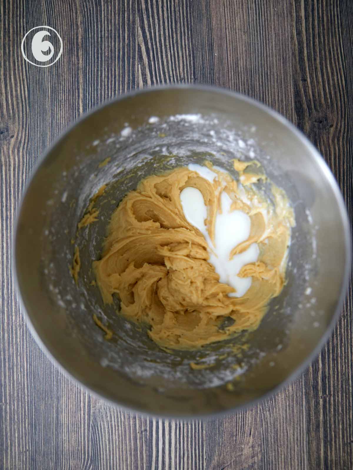 Mixing bowl with the cake batter and one third the milk.