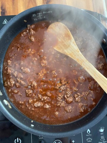 Chili mixture cooking in skillet.