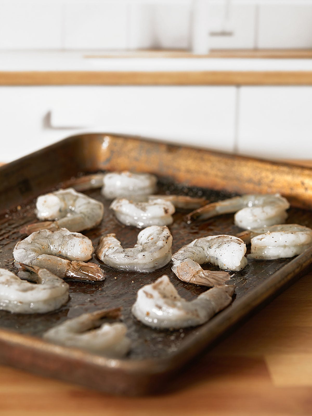 Roasted shrimp on a sheet pan.