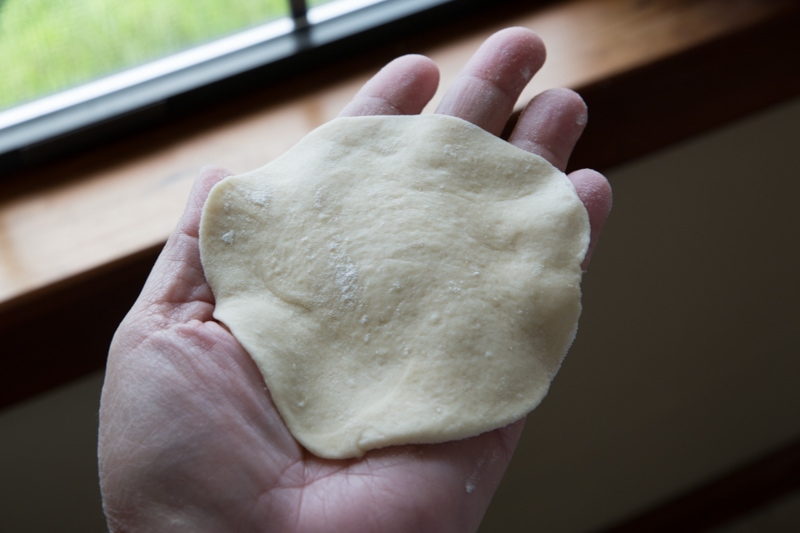 forming dough by hand.