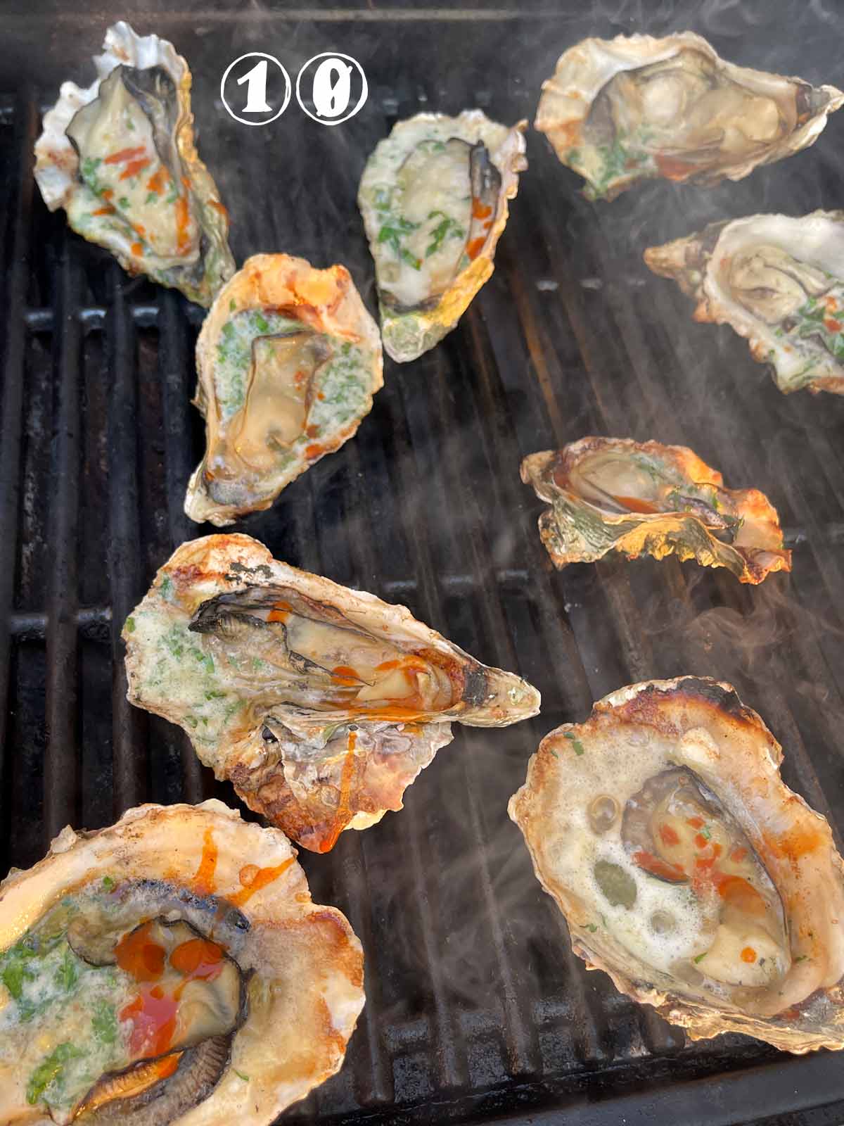 Grilled oysters with charred shells and crispy edges..