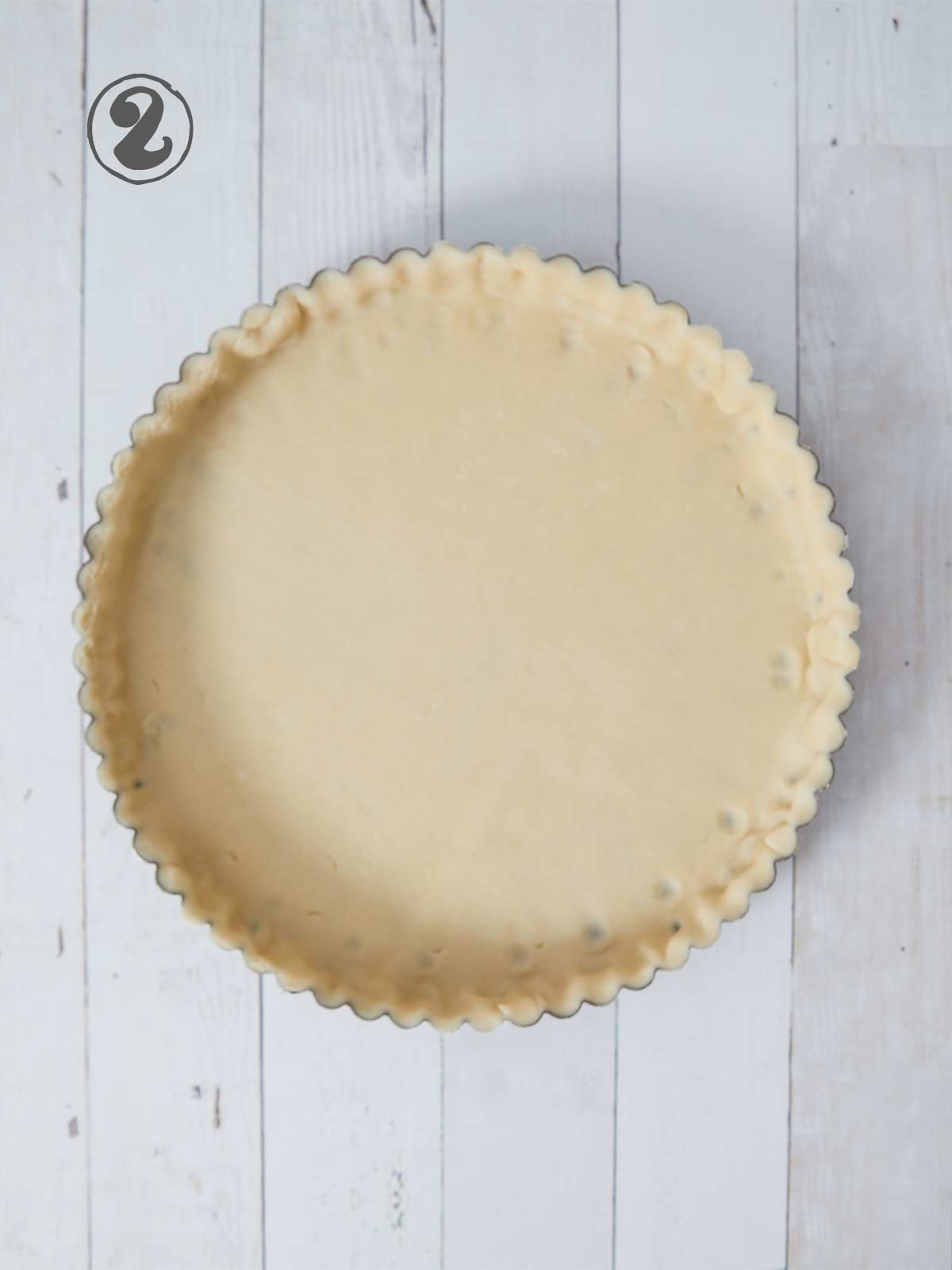 Pie crust in tart pan.