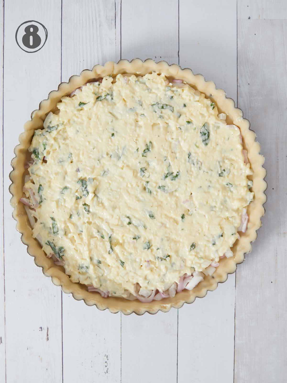Pie crust with a layer of cheese/herb mixture.