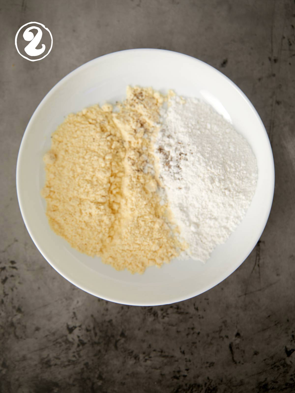 Breading ingredients in a white bowl.