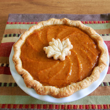 Whole autumn Autumn Pie with pie crust leaf garnish.
