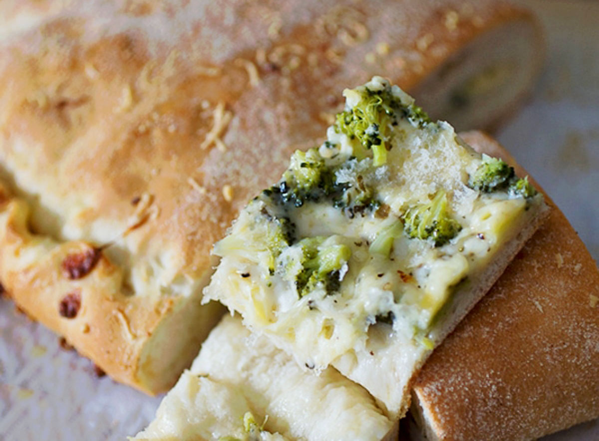 Aunt Carmen's Goudarooni - A slice of bread with broccoli and cheese.