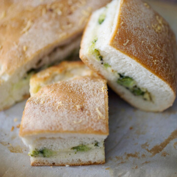 Image of bread with broccoli stuffed inside.