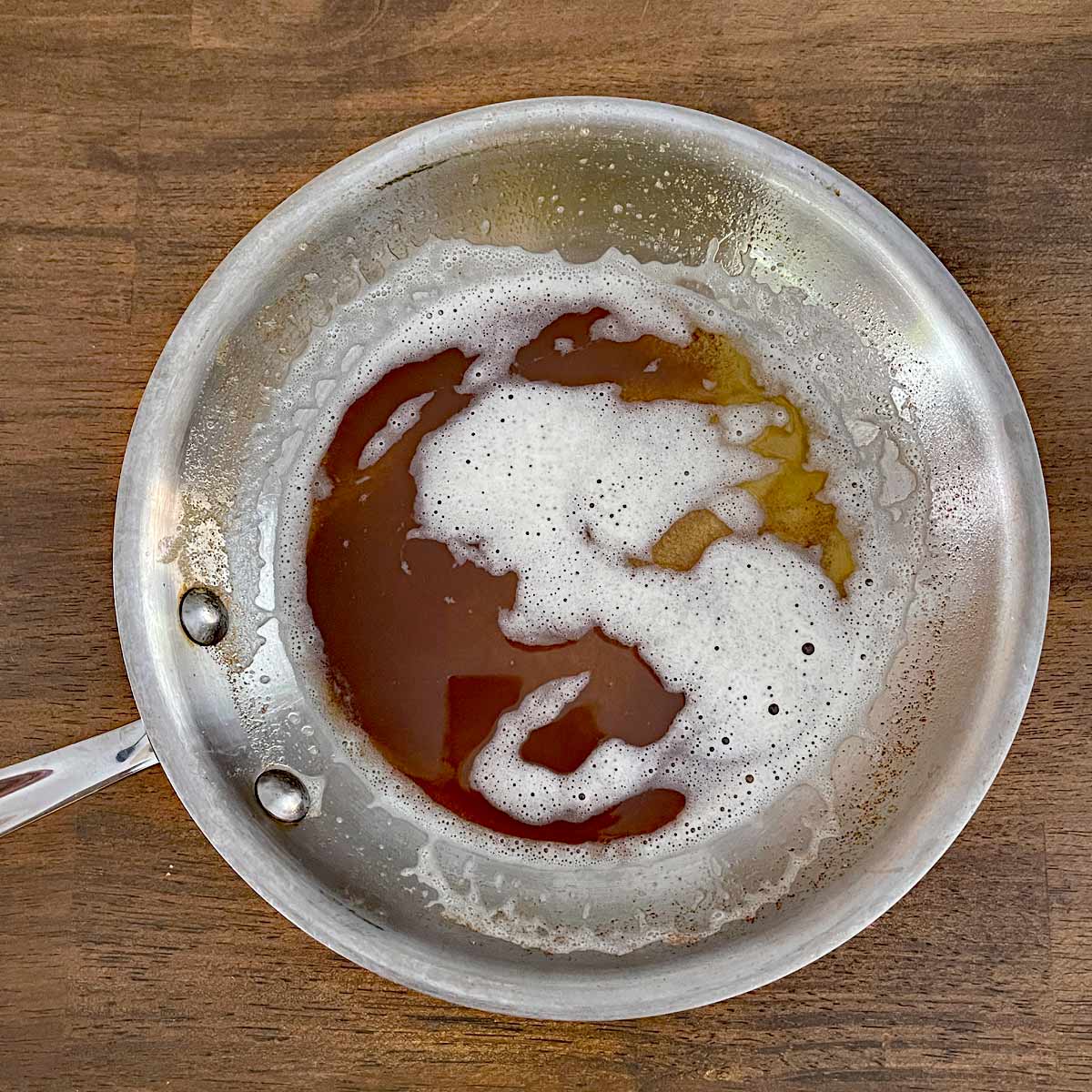 Saute pan with browned butter.