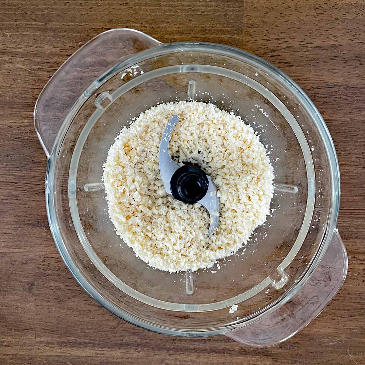 Macadamia nuts ground in the food processor.