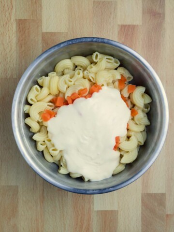 A bowl of Hawaiian Style Macaroni Salad with pasta and sauce.