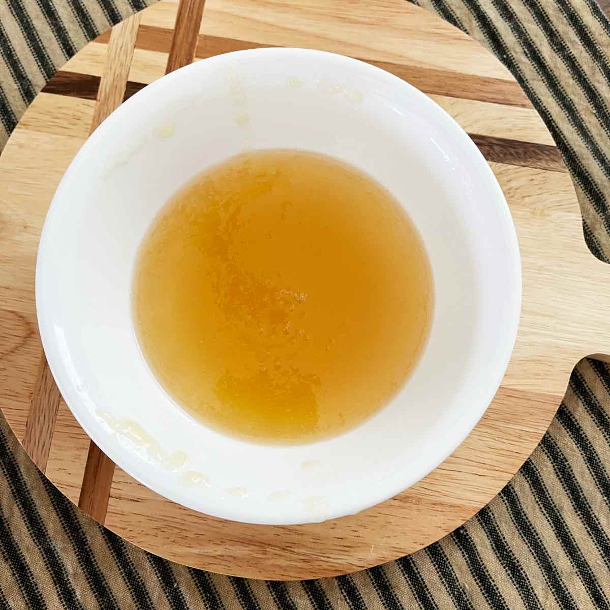 The liquid from the marmalade is cooling in the bowl.