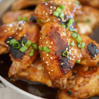 Close up of golden brown Asian chicken wings.