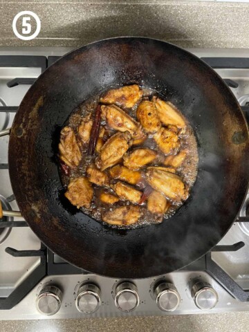 Grandmother's Chinese Chicken Wings fried in a wok on a stove top.