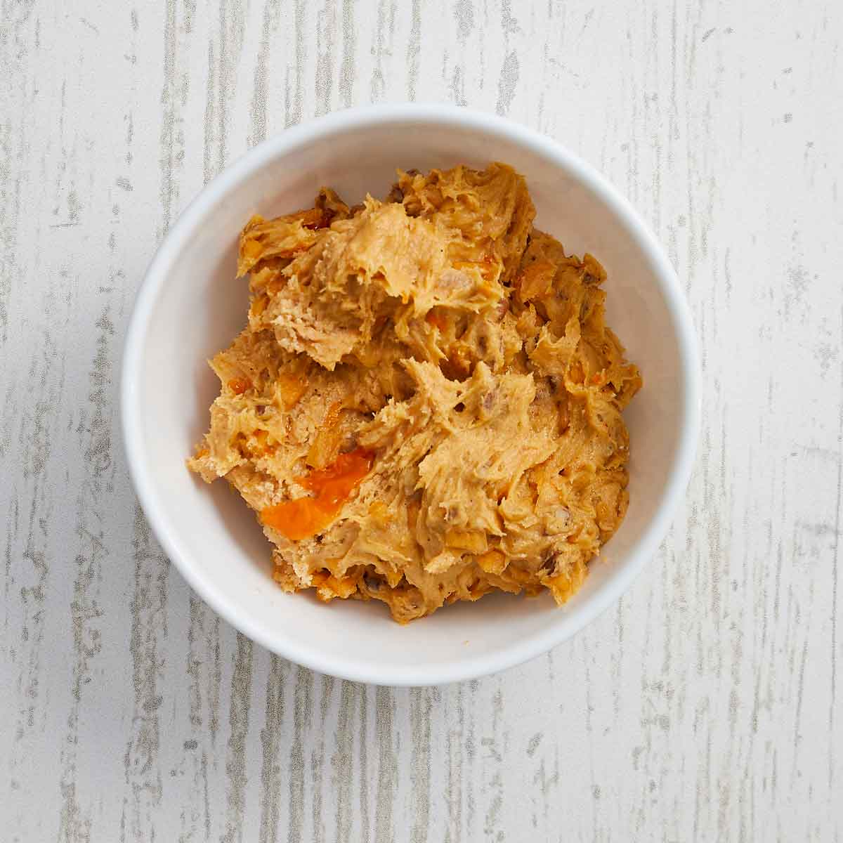 The cookie dough is in a smaller bowl ready for the refrigerator.