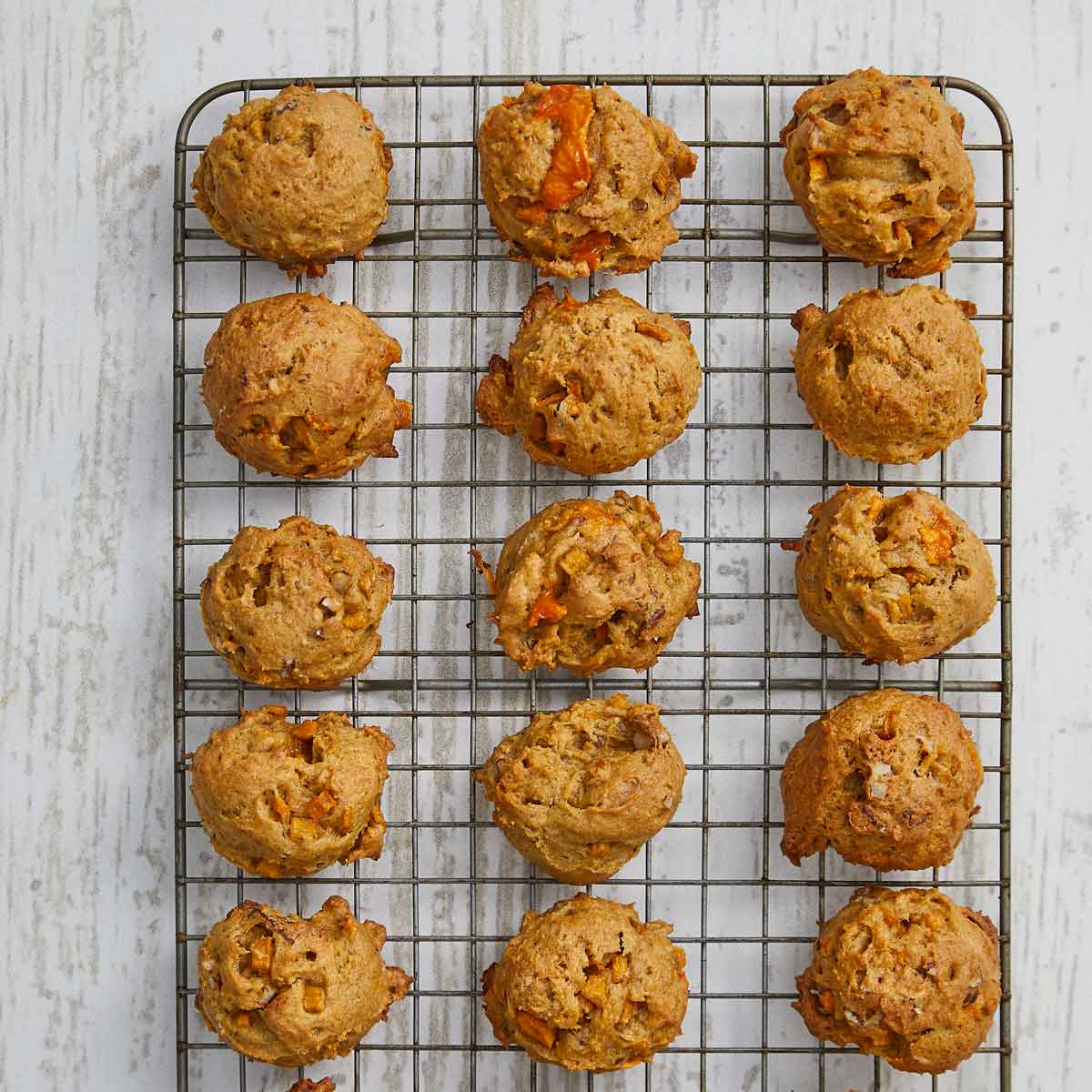 Baked cookies cooling on a wire rack.