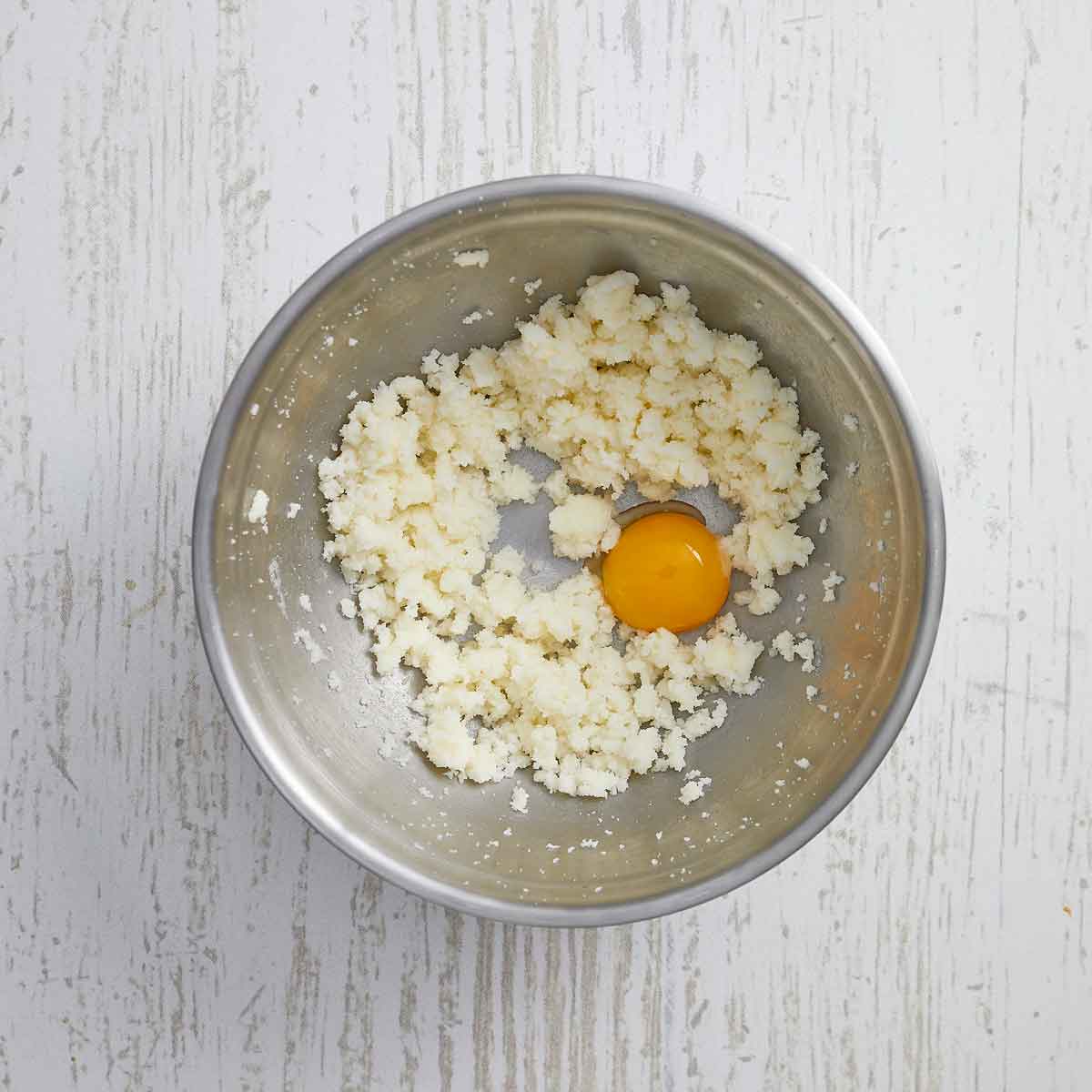 Creamed sugar and butter with an egg yolk added.