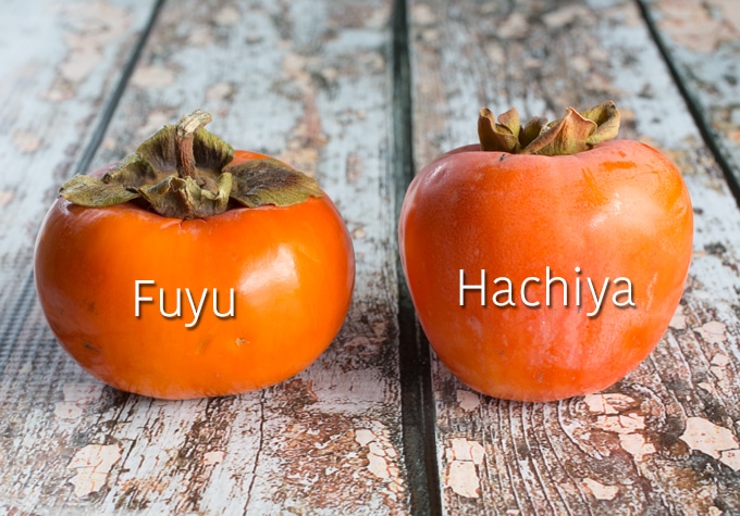 Fuyu and Hachiya persimmons side by side.