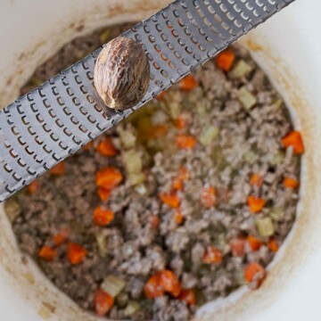 Image of the pot with a micro lander grating fresh nutmeg.