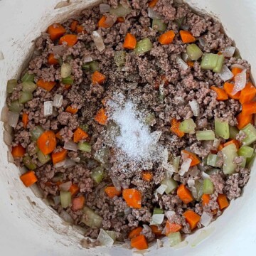 Image of the pot with all the liquid reduced and salt and pepper added.