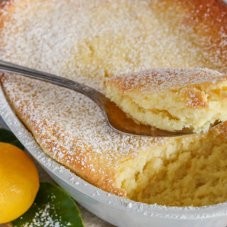 Lemon cake with spoonful taken out.