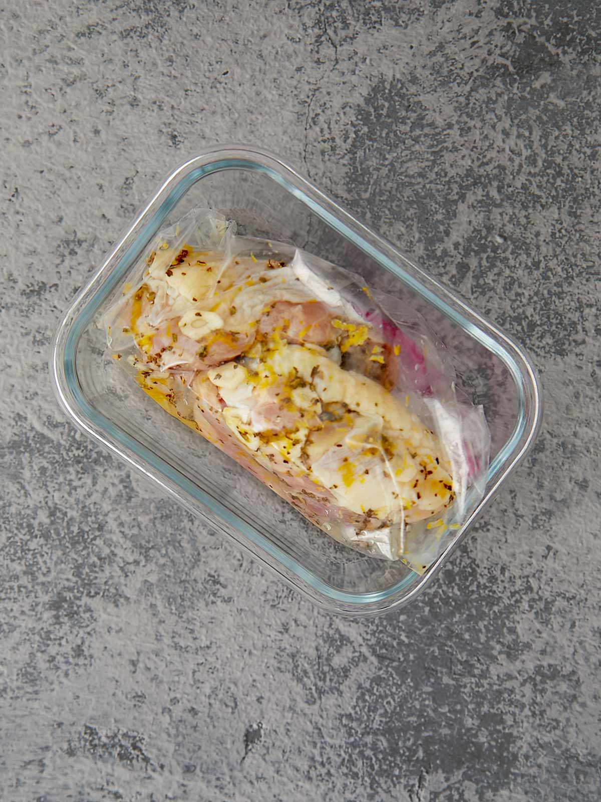 Zip top bag with chicken and marinade.