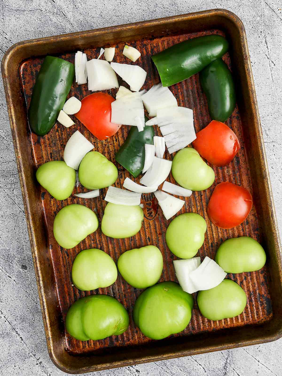 Baking sheet with the cut vegetables.