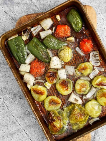 Roasted vegetables on the sheet pan. Tops have a little bit of char on them.