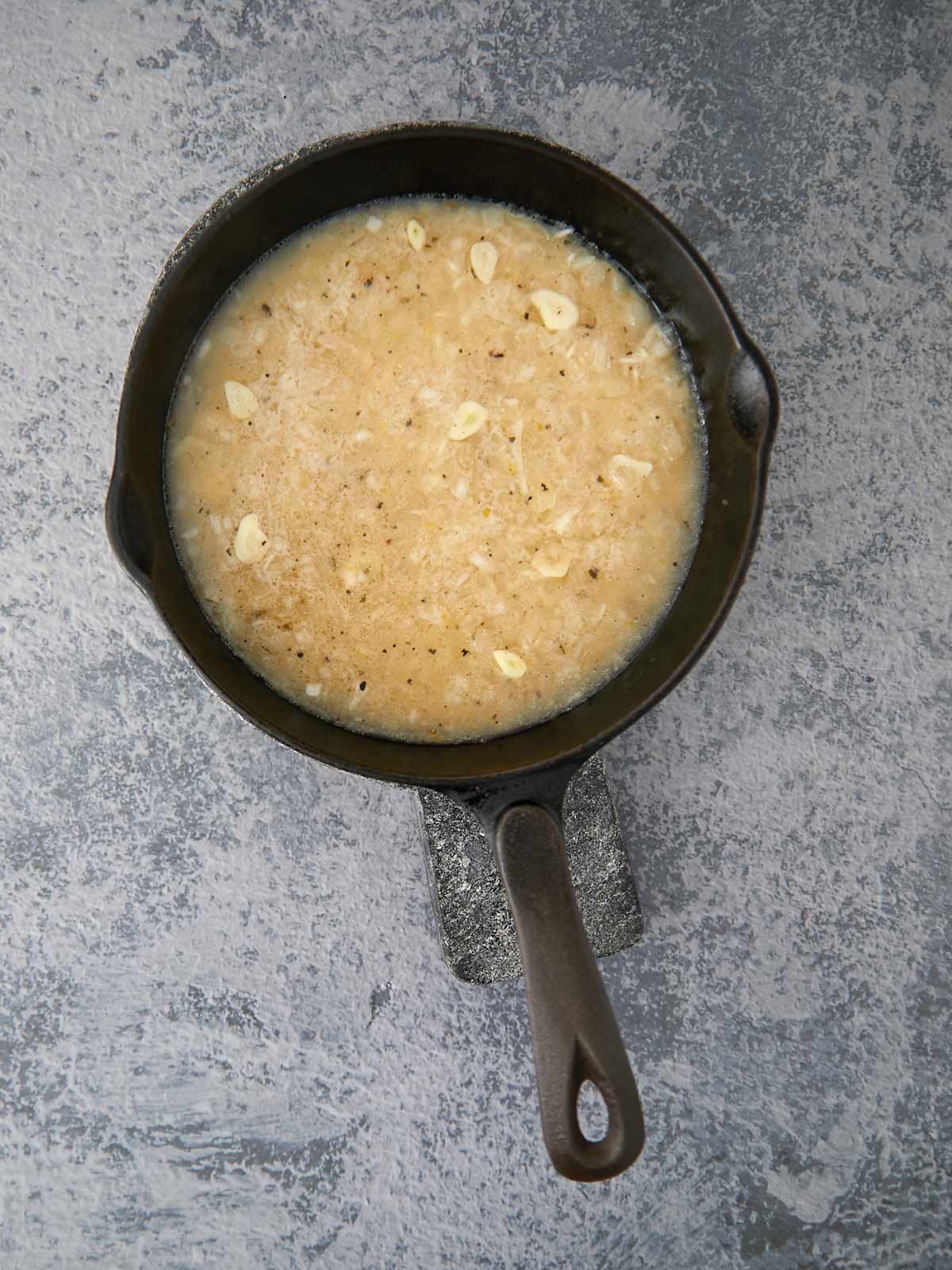Skillet with rice aft simmering briefly.