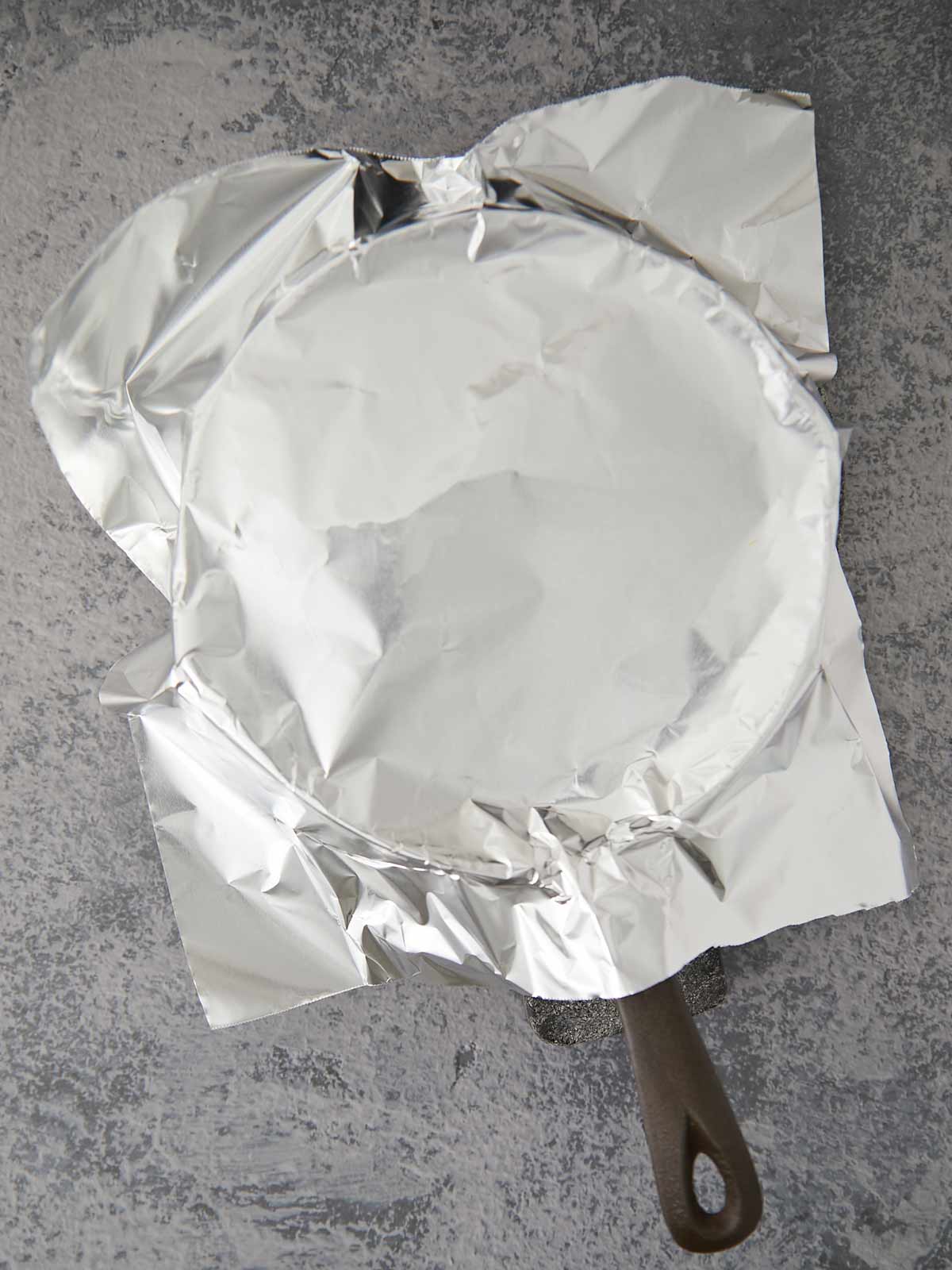 Skillet covered with foil.