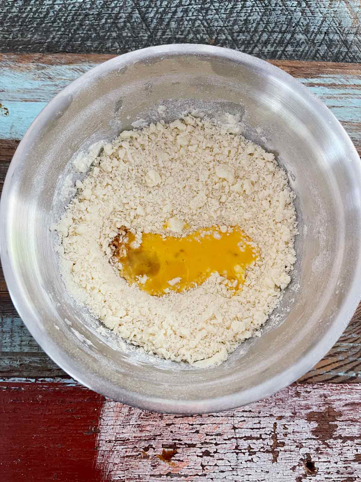 Mixed up dough with egg poured on top.
