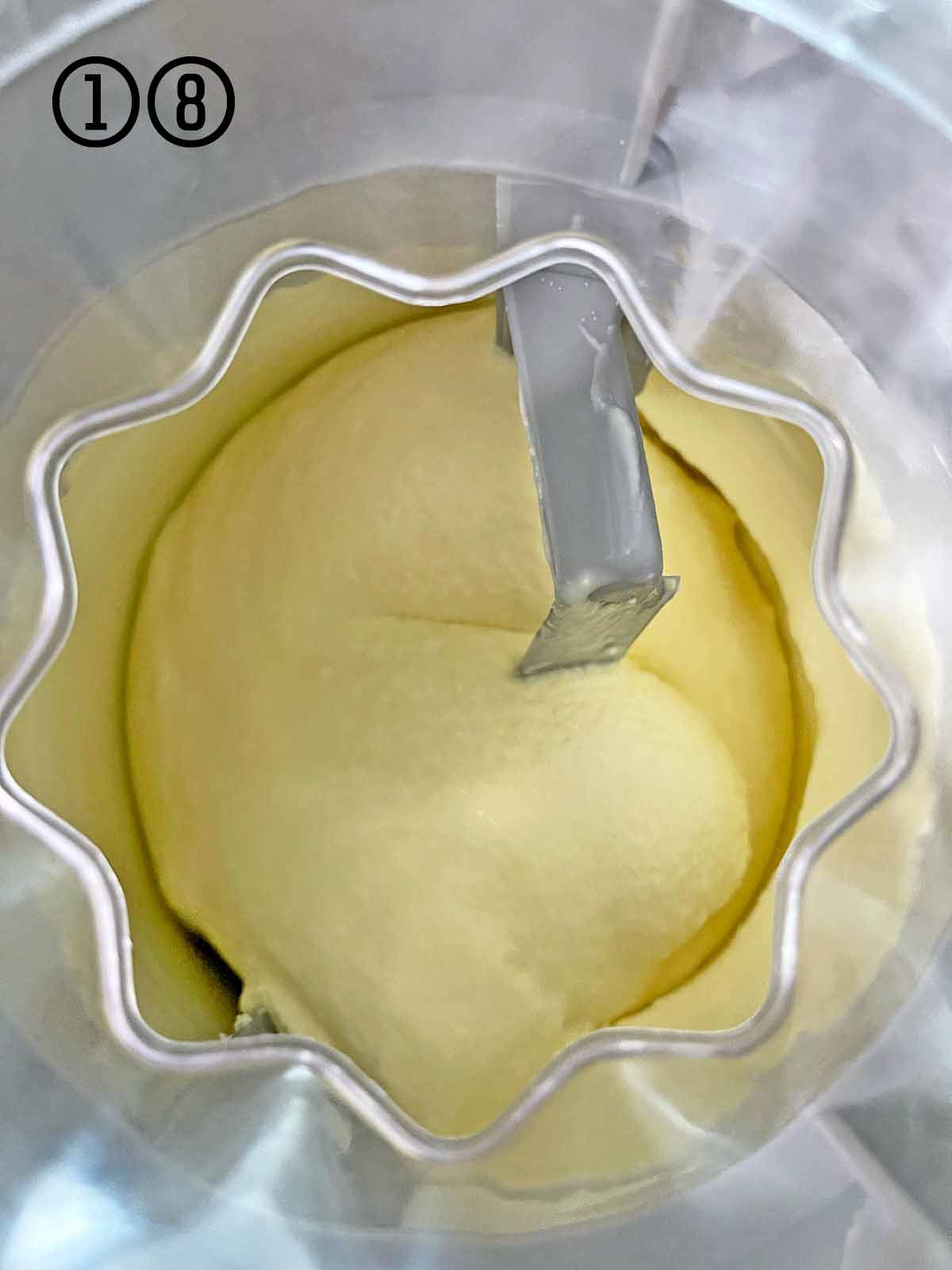The ice cream maker with the churned soft serve ice cream.