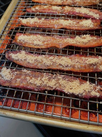Brown sugar has been applied to the opposite side of the bacon slices.
