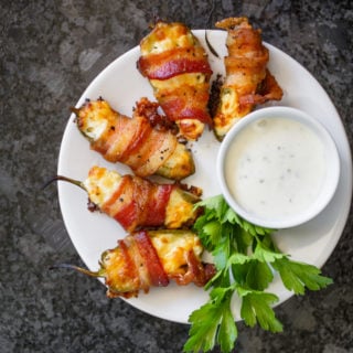 Jalapeno poppers with bacon wrapped around ready to eat.