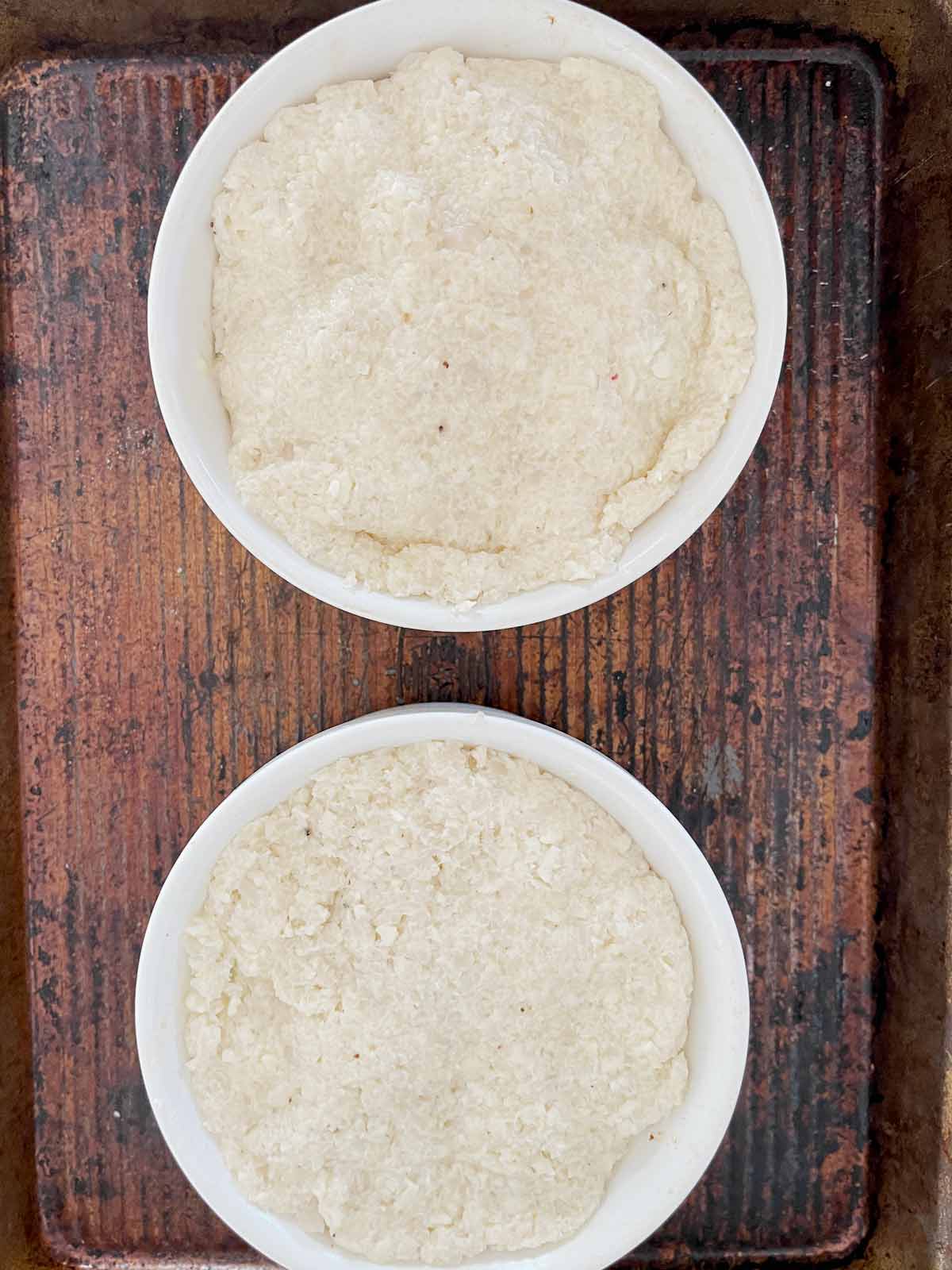 Cauliflower crusts on both ramekins.
