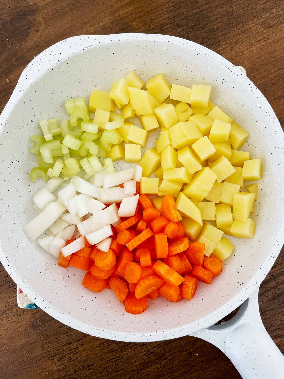 Diced vegetables in skillet.