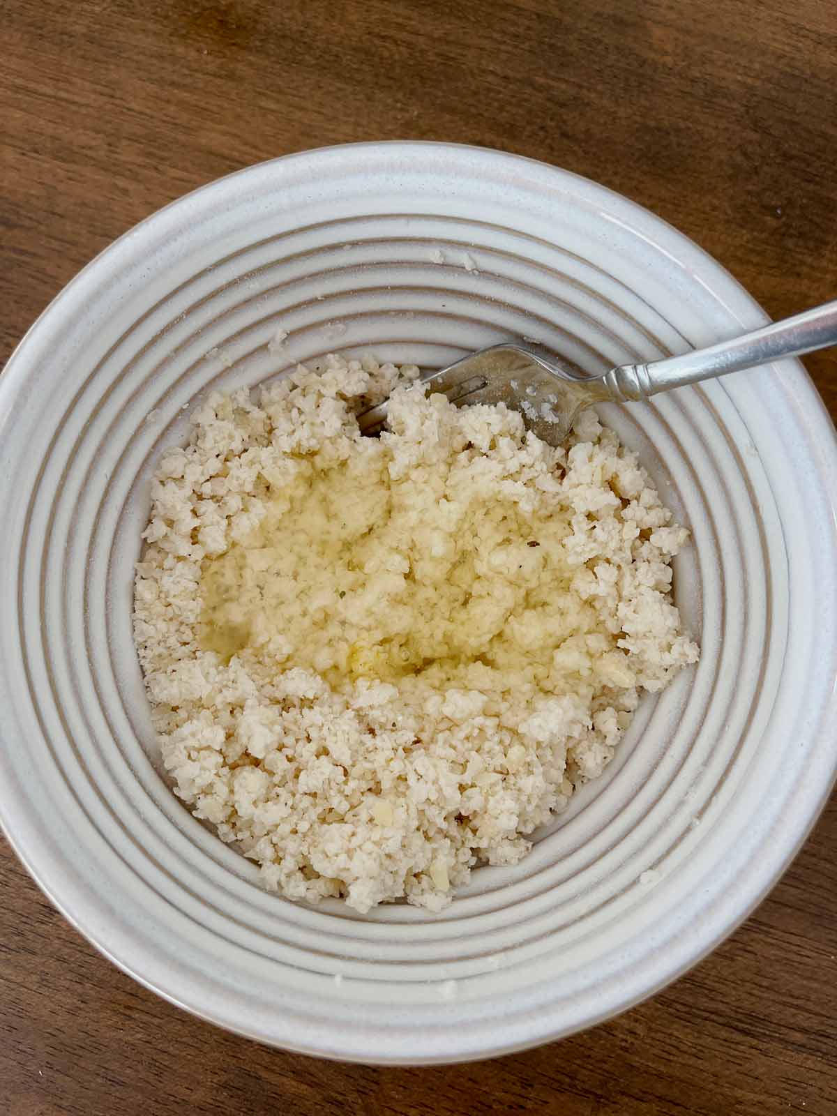 Egg white added to cauliflower crust mixture.