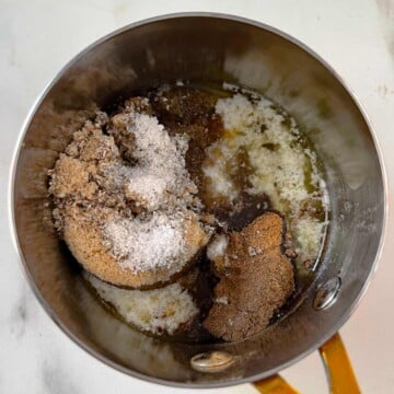 Butter, brown sugar, spices, and maple syrup in a small pot.